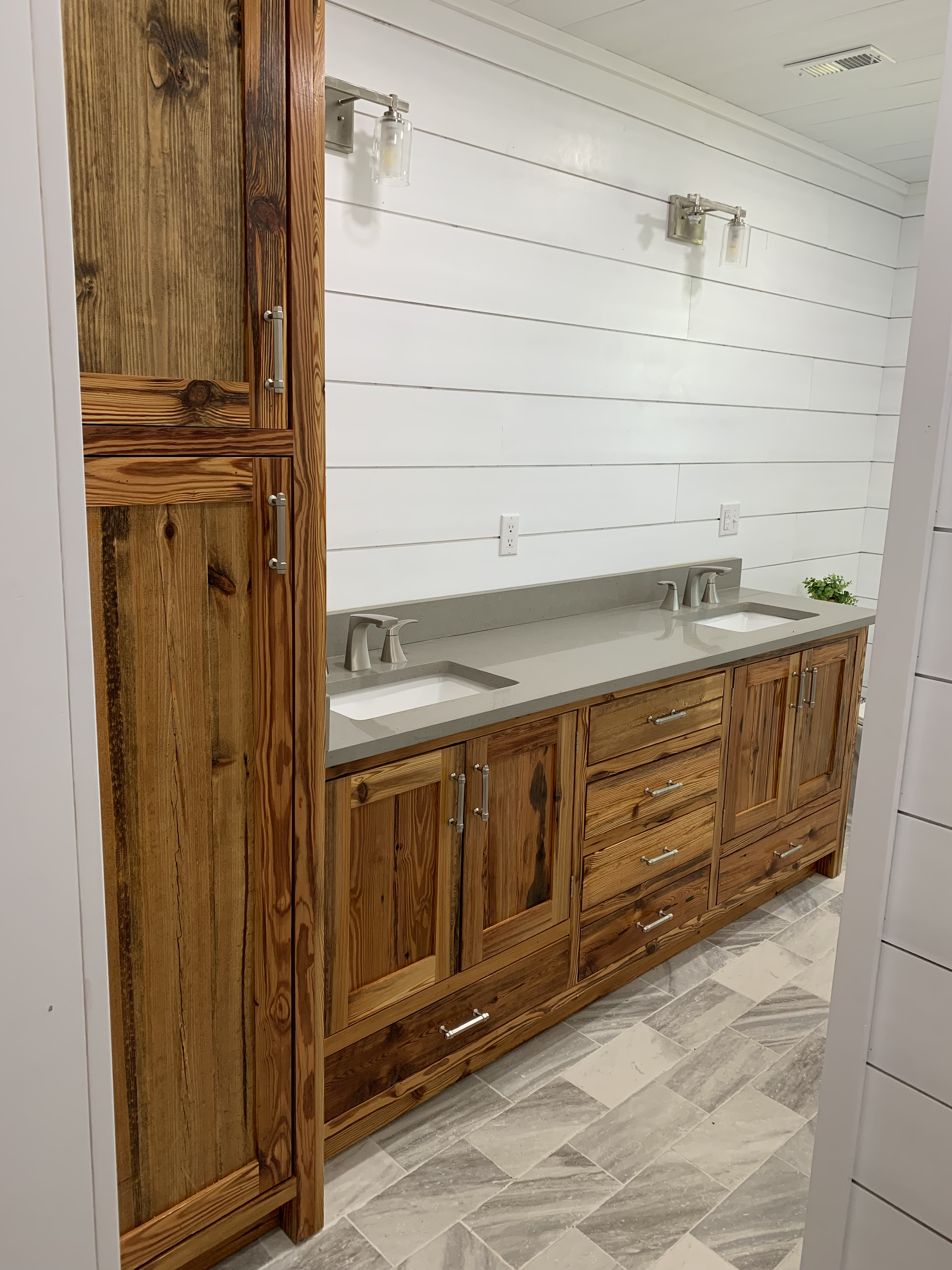 Modern kitchen cabinetry with center island by AMJ Homes