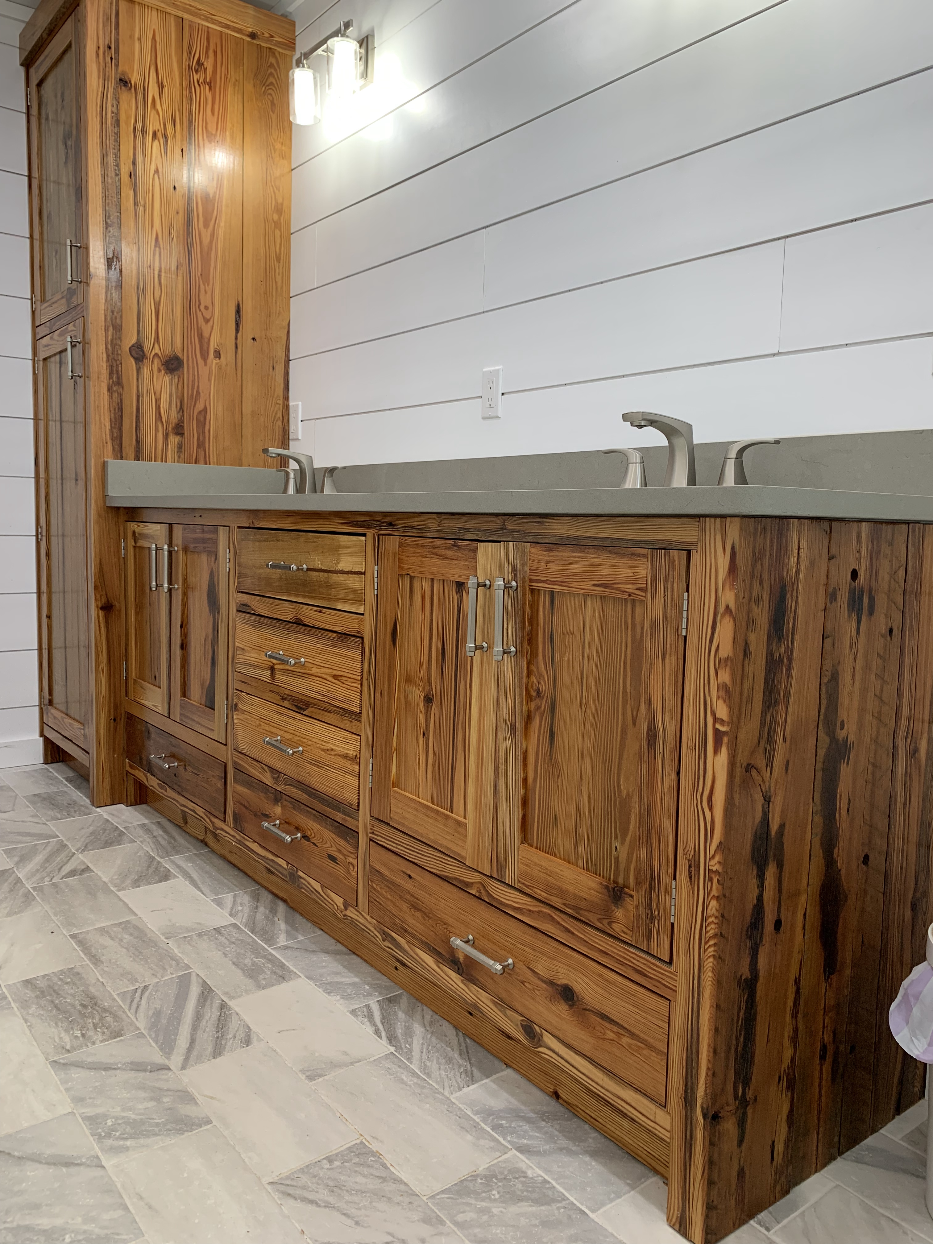 AMJ Homes cabinet installation featuring granite countertops