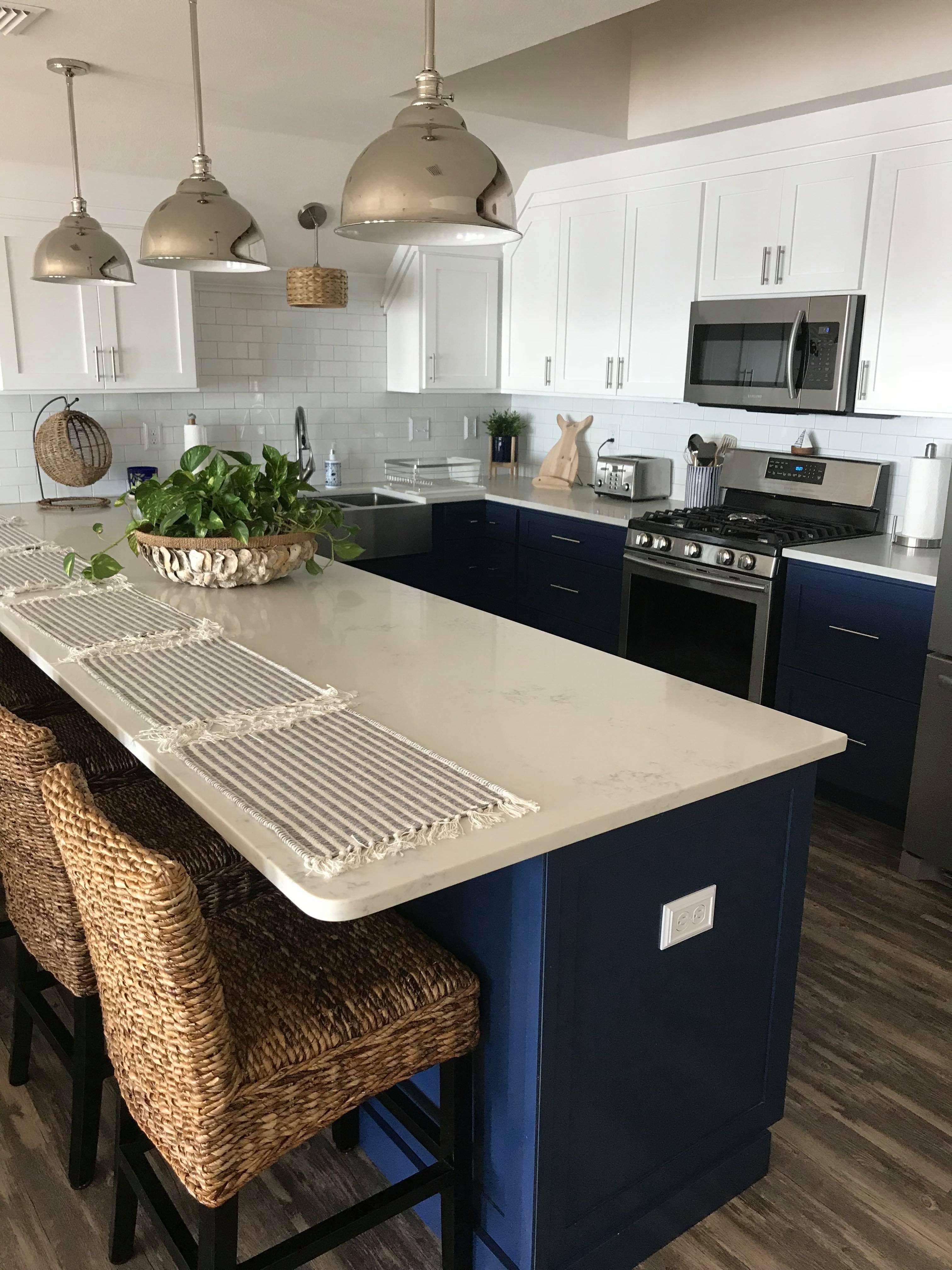 White shaker-style kitchen cabinets installed by AMJ Homes
