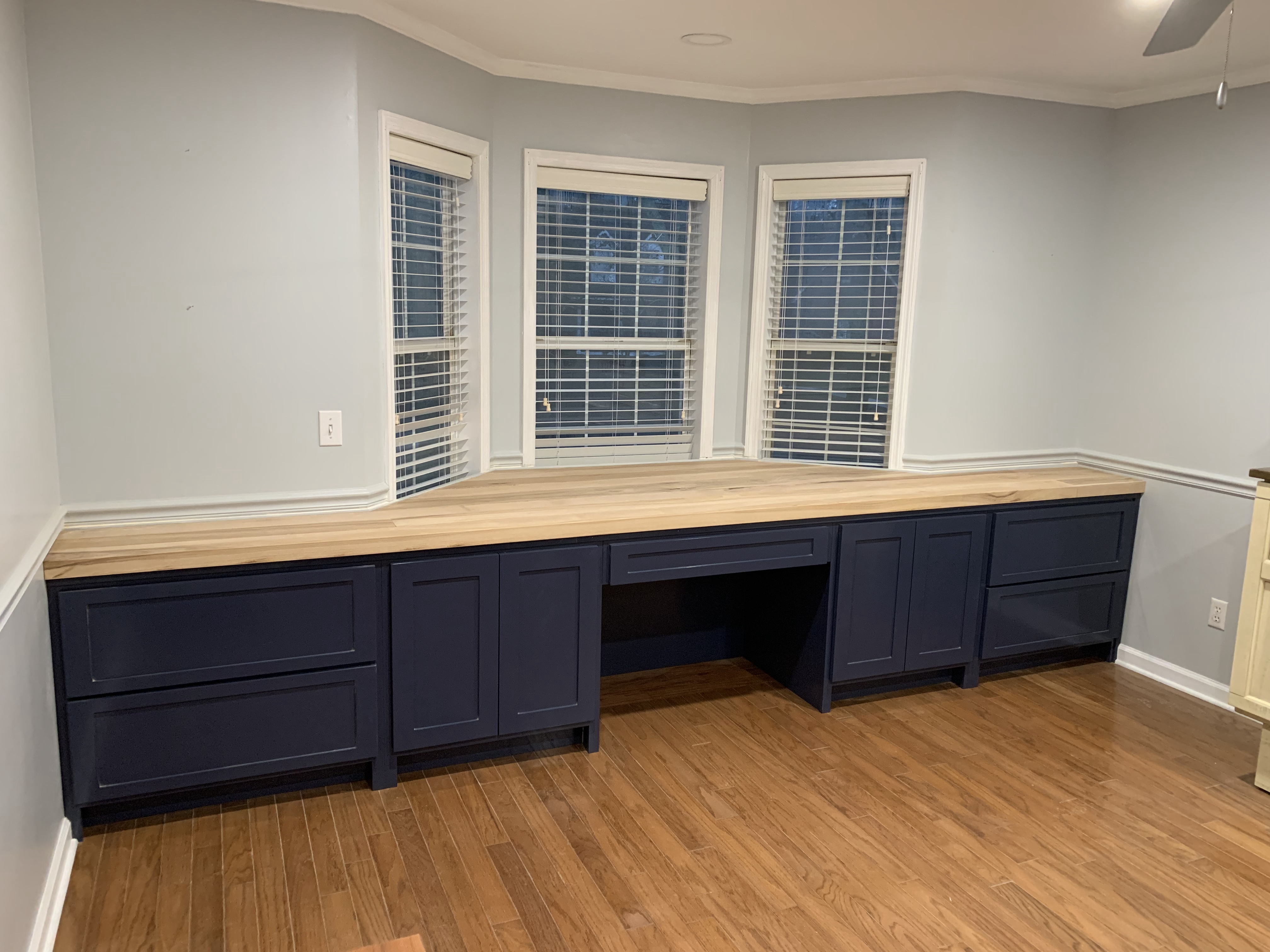 Custom wood cabinetry built for storage and style by AMJ Homes